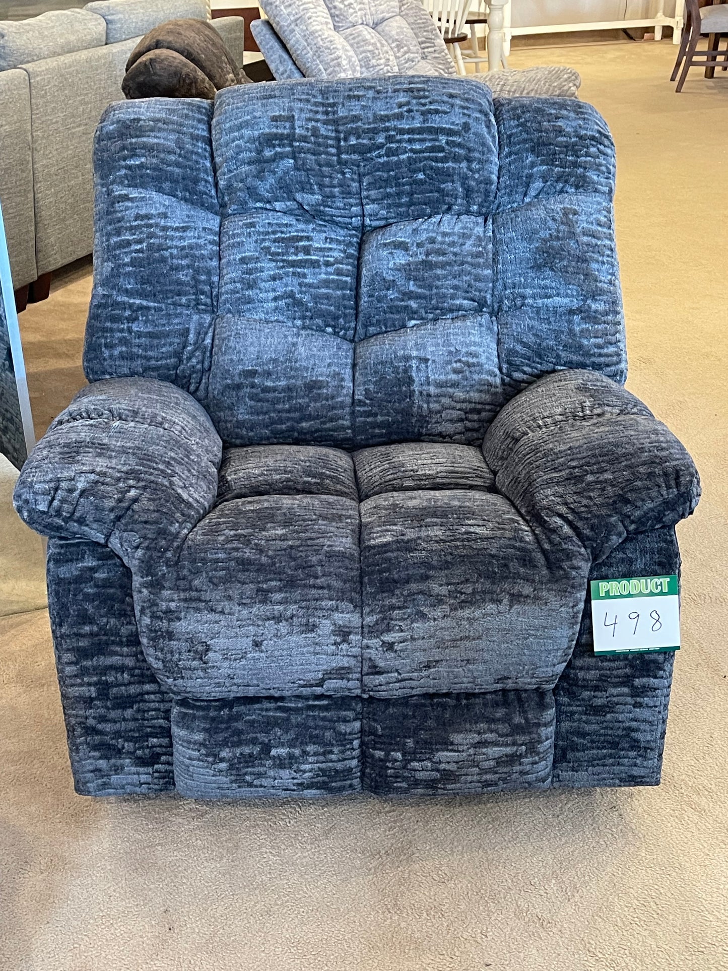 a blue couch sitting next to a blue couch