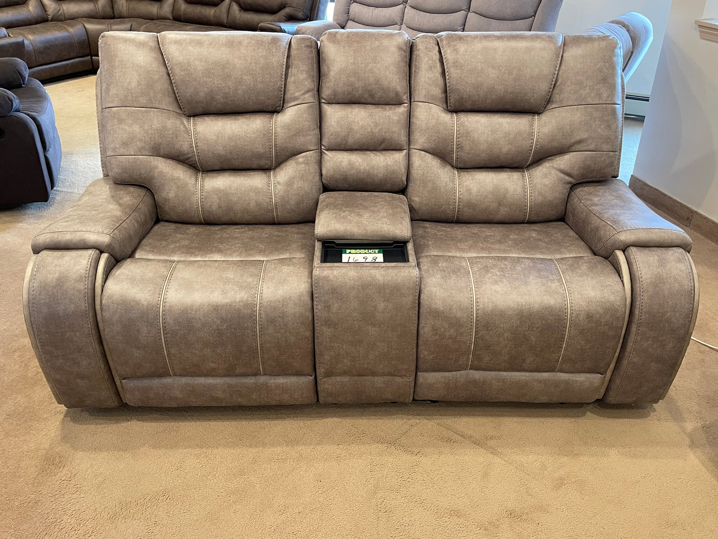 a couch that has a bunch of pillows on it