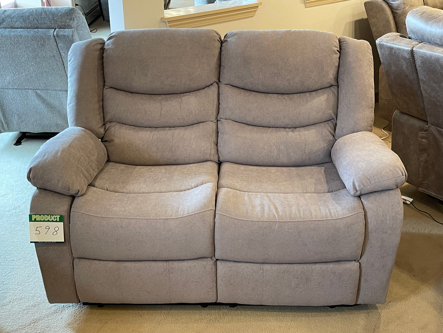 a couch sitting in a living room next to a couch