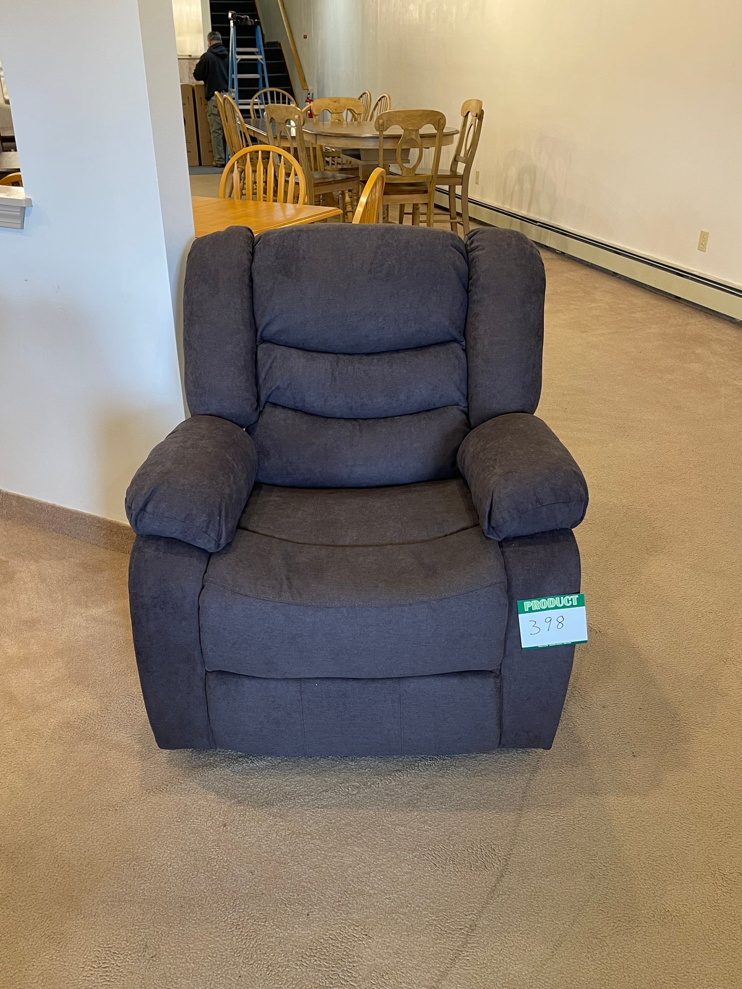 a blue couch sitting on top of a hard wood floor