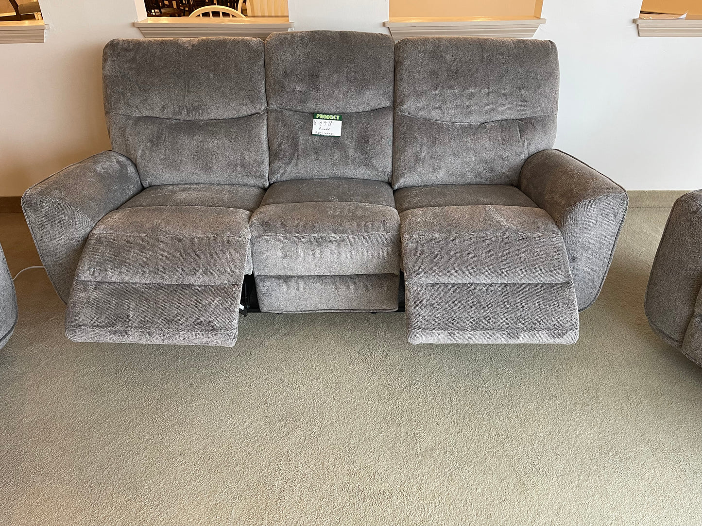 a living room filled with furniture and a couch 