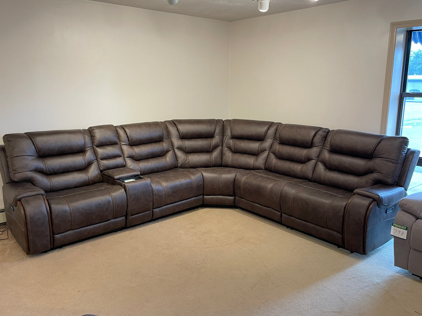 a close up of a leather couch in a room 