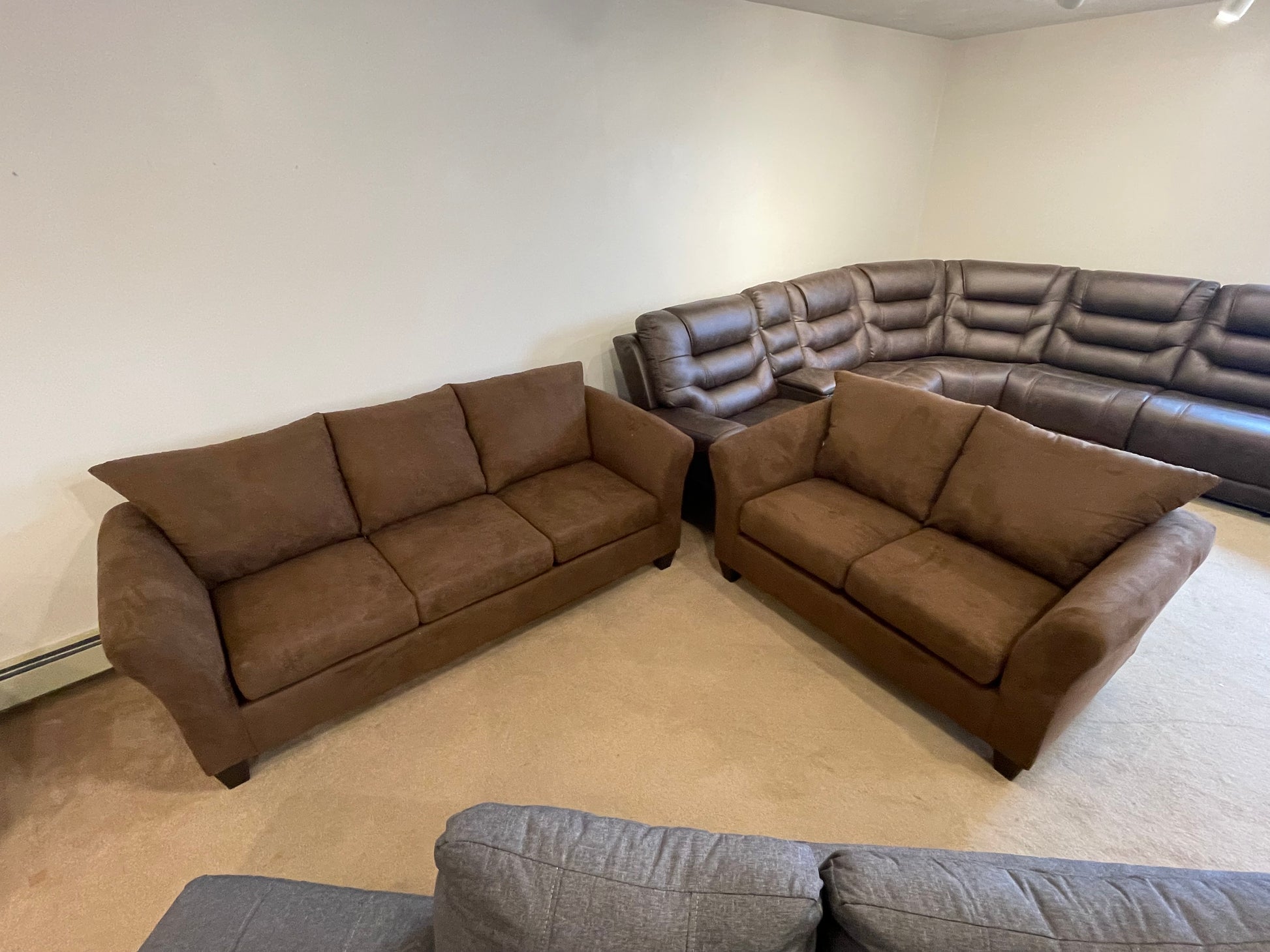 a living room filled with furniture and a couch 